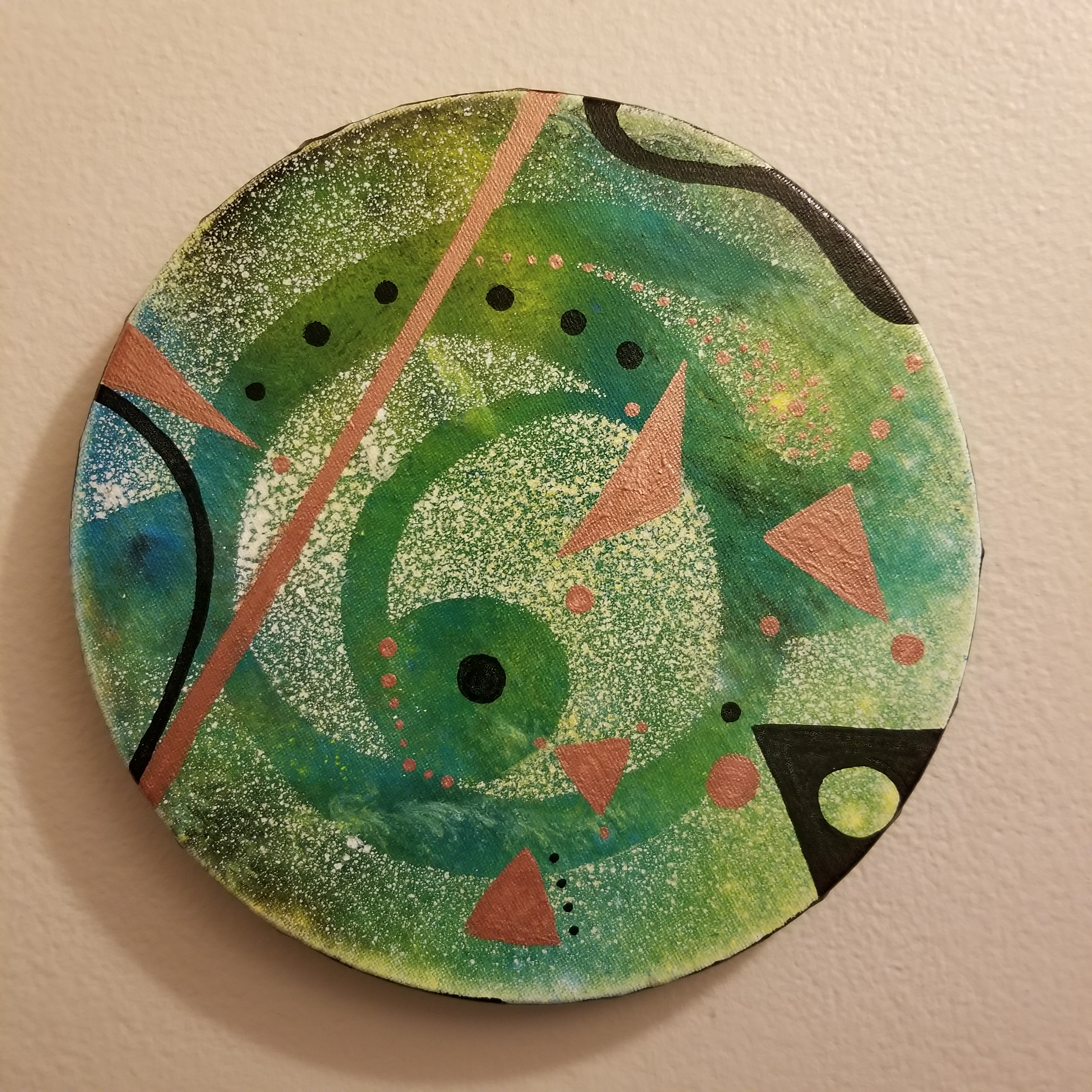 green and metallic copper geometric shapes and lines over a white stencilled spraypainted abstract form andorganic green and yellow color field inspired by pennsylvania dutch hex signs